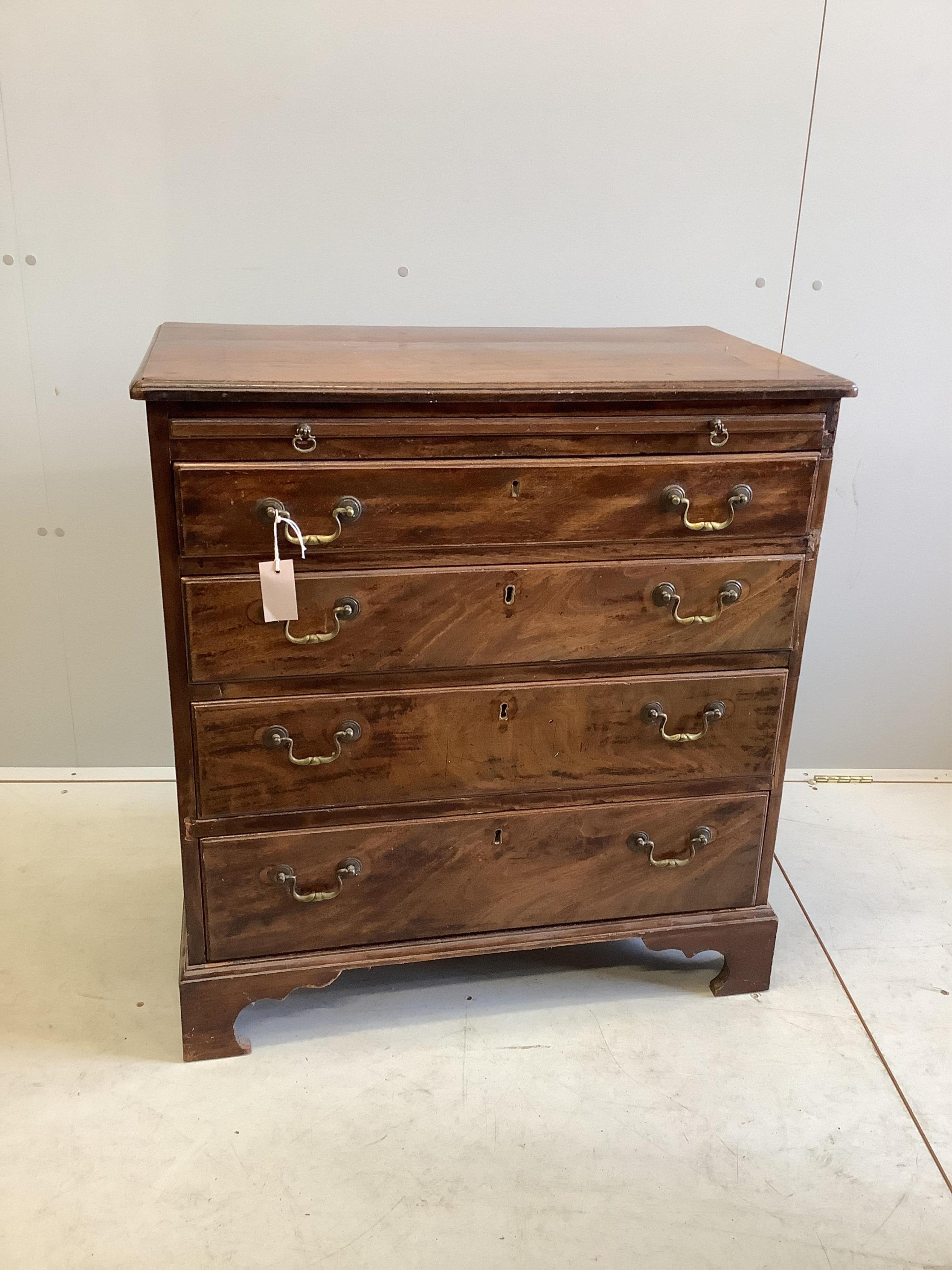 An early 19th century mahogany straight front chest of four long drawers and brushing slide, brass handles and bracket feet, width 78cm, depth 45cm, height 85cm